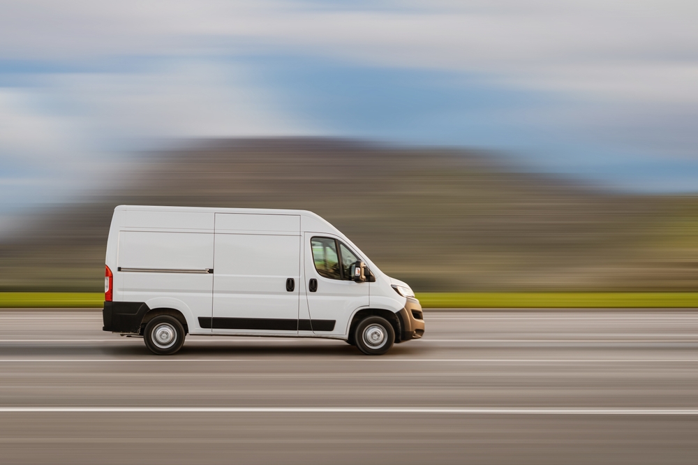 Cargo,Van,Is,Driving,On,The,Highway,At,Speed,With